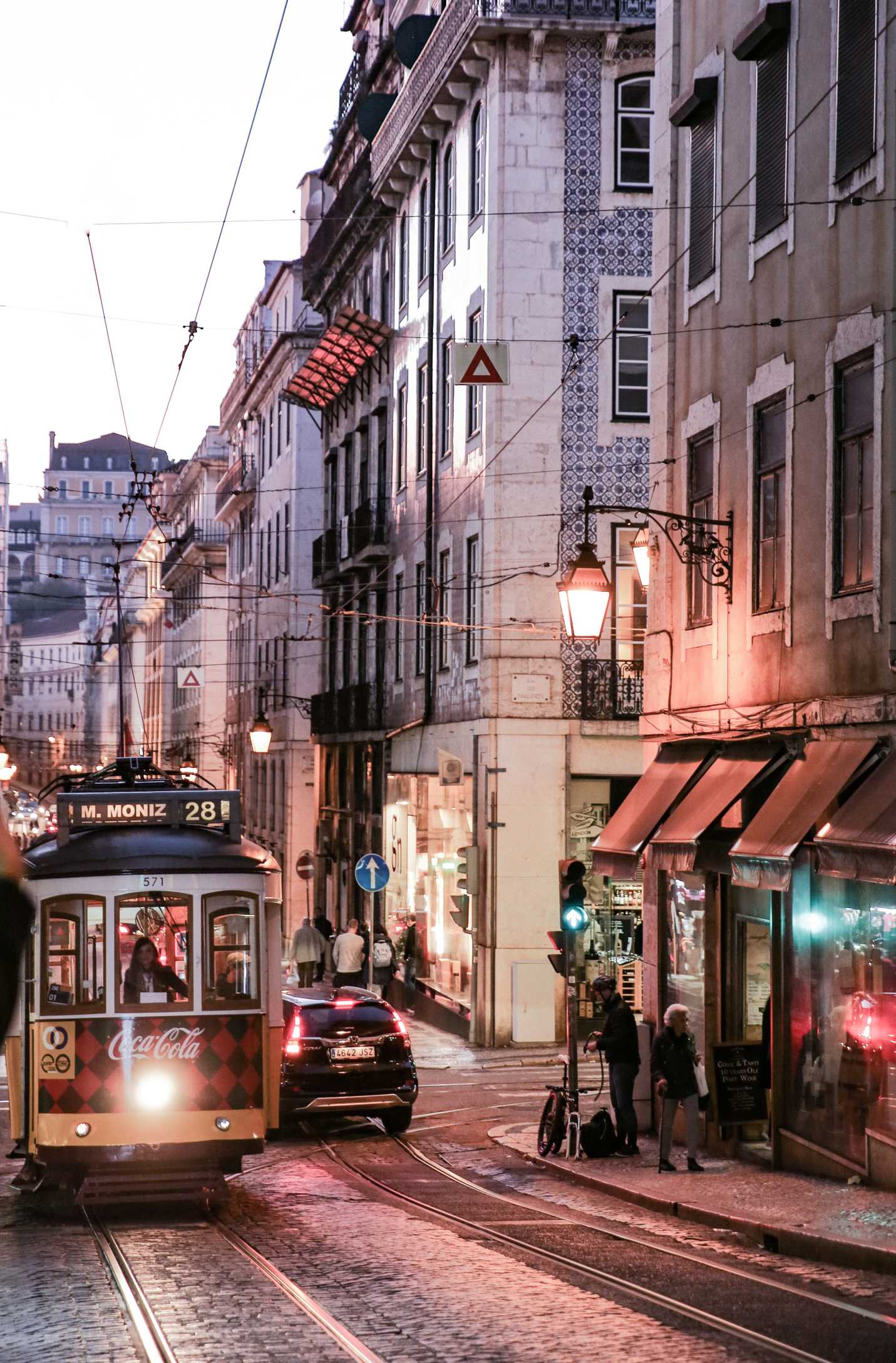Famous yellow Tram 28 in the streets of Portugal